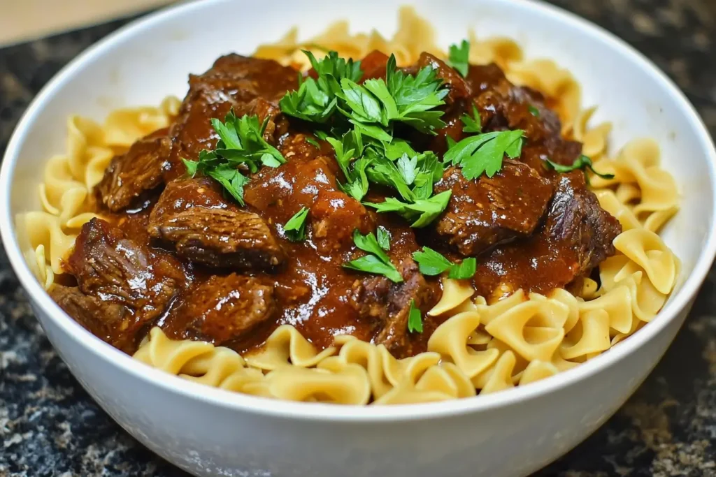 Delicious bowl of crockpot beef tips and noodles