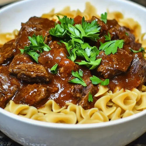 Delicious bowl of crockpot beef tips and noodles